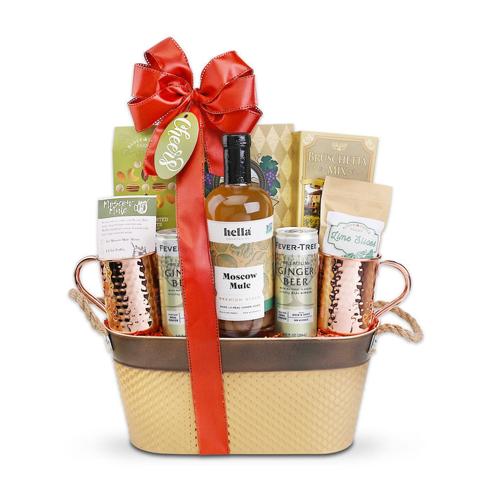 Ginger beer gift basket with copper mugs, mule-style bottle, and red ribbon