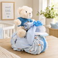 Motorcycle diaper cake gift basket with plush bear, blue sweater, ribbon, rolled diapers