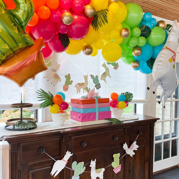 Neon tropical balloon garland with colorful clusters and llama foil balloon
