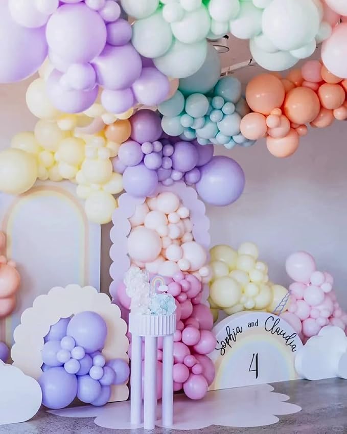 Pastel balloon arch garland with pastel balloon clusters and a white decorative panel