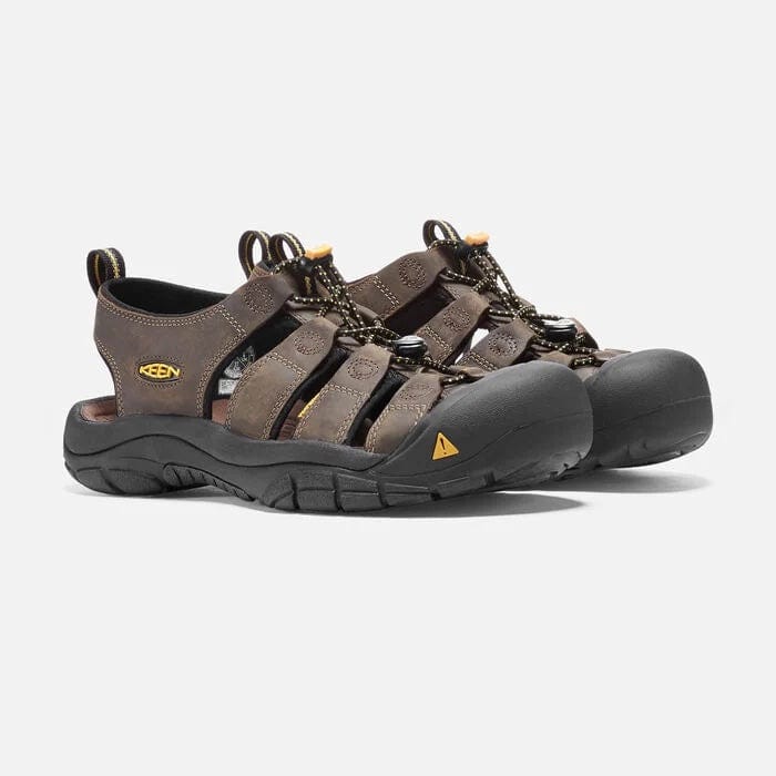 Keen Newport Leather sandals in brown leather with closed-toe design, bungee lacing system, and black rubber outsole, angled front view.