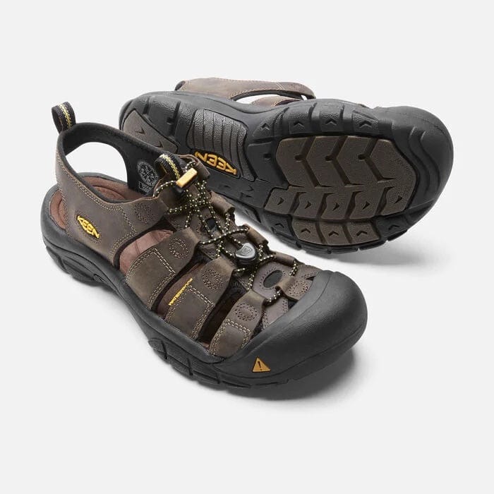 Keen Newport Leather sandals in brown with closed-toe design, adjustable laces, leather straps, and durable rubber outsole, angled view.