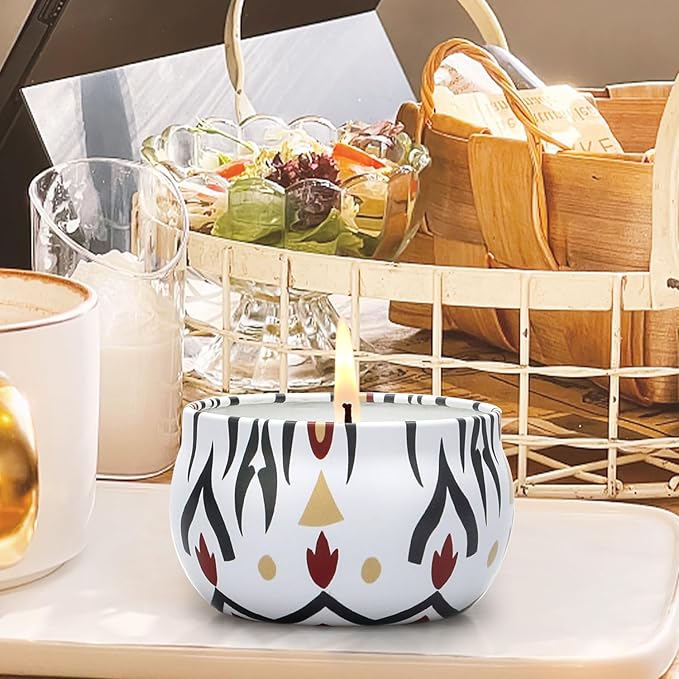 Decorative ceramic scented candle with white base and black drip pattern