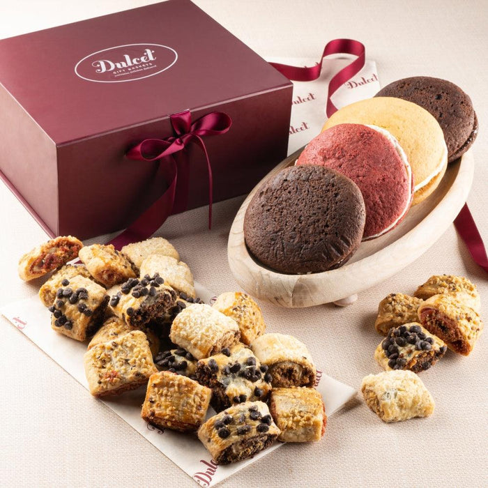 Signature gift basket with ribbon and assorted cookies on a plate