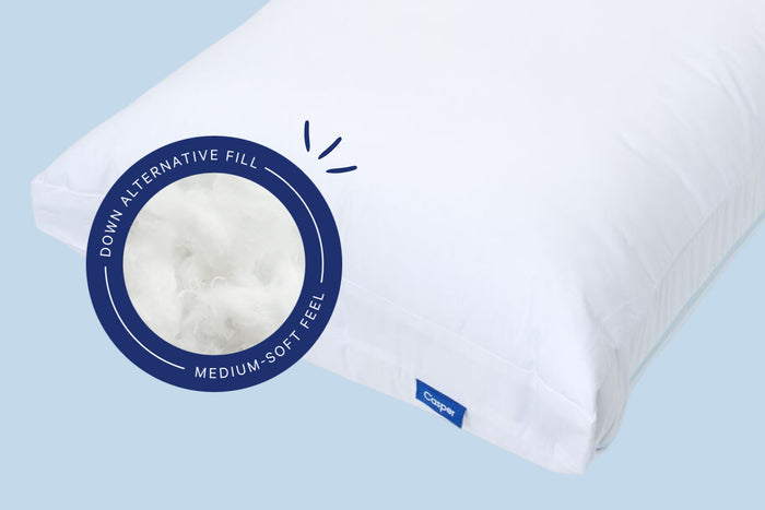 White pillows with text and graphics on a light blue background. Casper's Original Cooling Pillow has a down alternative fill with a medium-soft feel.