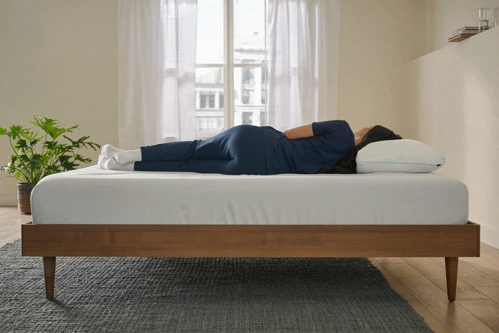 Motion image of a woman sleeping on a bed in different positions