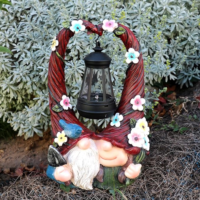Resin gnome couple with glowing lantern under floral vine ring, outdoor yard decor