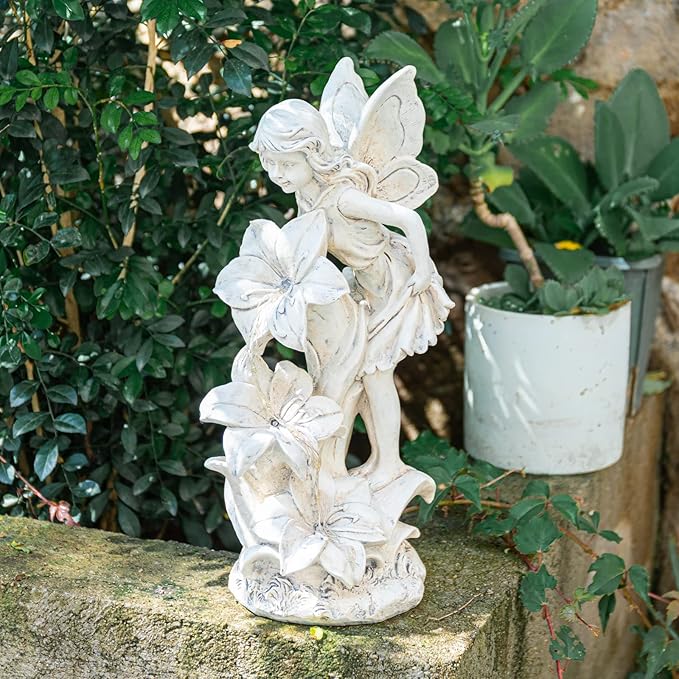 White resin garden fairy angel statue holding trumpet flowers, standing on base