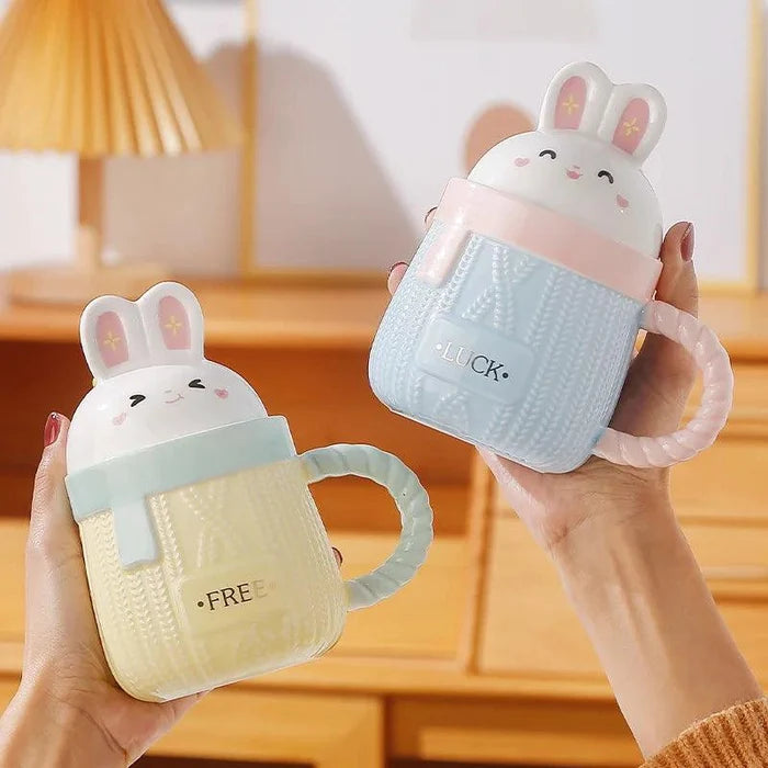 Yellow bunny ceramic mug with rabbit lid, textured body, and 'FREE' text.
