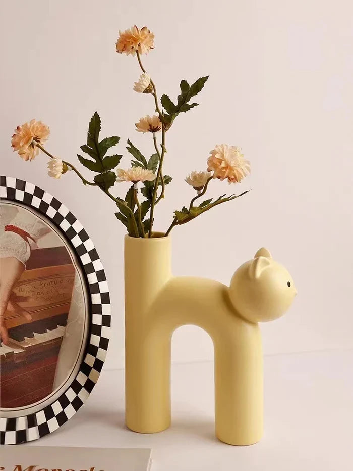 Pastel ceramic cat flower vase in yellow with flat tube opening, cat figure