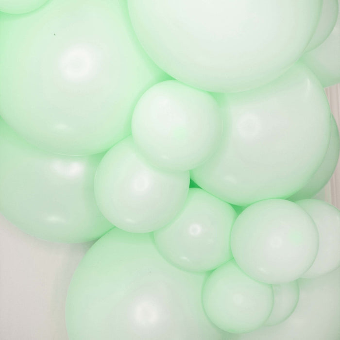 Pastel green balloon garland cluster of round balloons