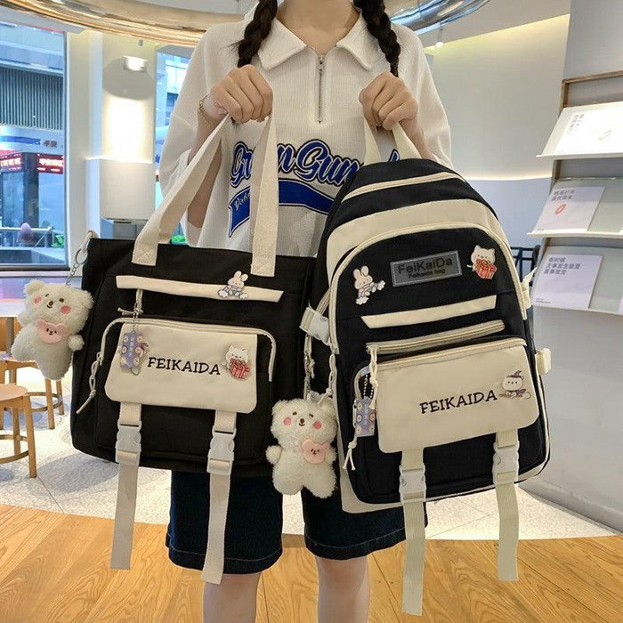 Waterproof bag set in black and cream with mini shoulder bag and backpack