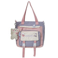 Lavender waterproof shoulder tote with front zip pocket and plush keychain charm