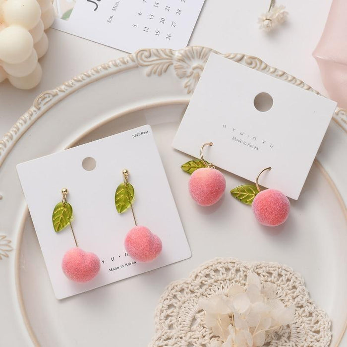 Peach earrings: green leaf charms with pink pom-pom drops