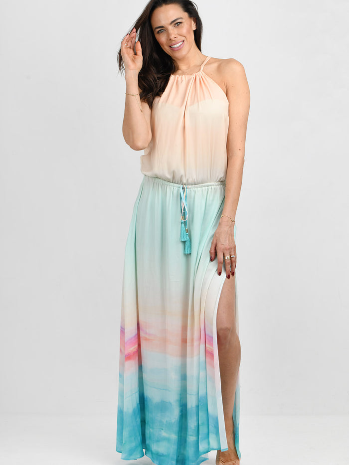 Model wearing the Pelosa dress in golden hour ocean  by NAIA Beach