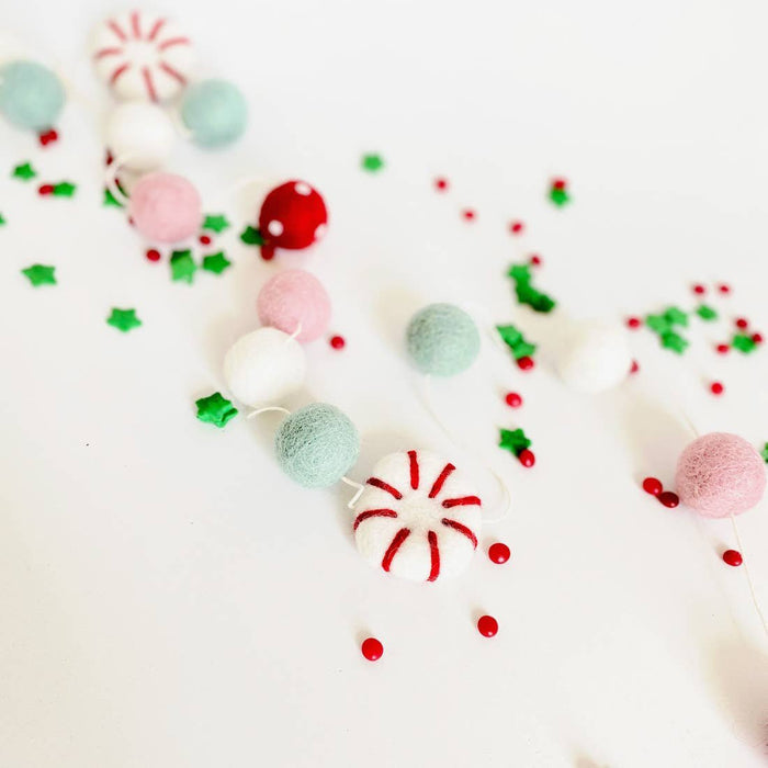 Peppermint felt ball garland with red, pink, mint and white felt balls on a string