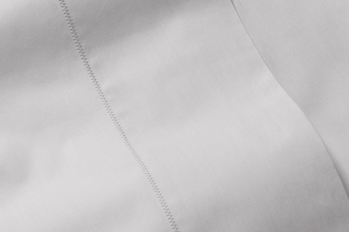Close-up of percale sheet set, gray