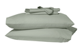 Folded sheets on top of two stacked pillows in pillowcases. Green eucalyptus colors.