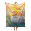 Personalized blanket held up, fluffy bird with flower crown and name Amelia