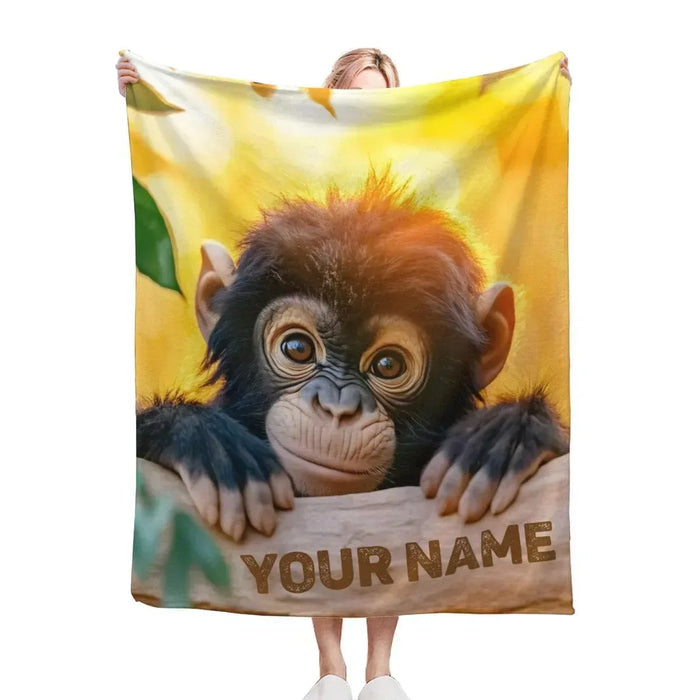 Personalized baby chimpanzee blanket with a chimp face and 'YOUR NAME' lettering