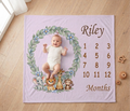 Lavender milestone blanket with baby photo in wreath, Riley name, and months numbers