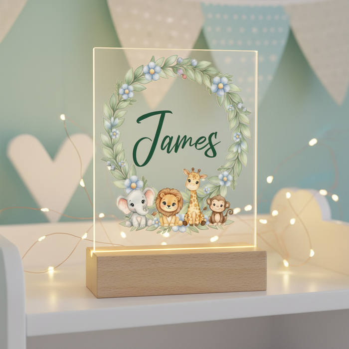 Acrylic front night light with safari wreath and custom name, softly lit.