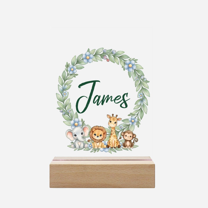 Wooden-base night light with safari animal wreath and custom name design.