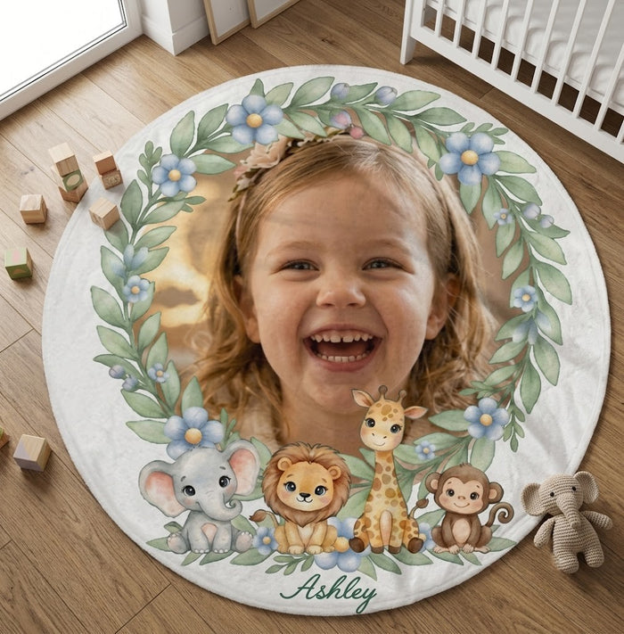 Round blanket lying on floor with safari animals, leaf frame, and name Ashley
