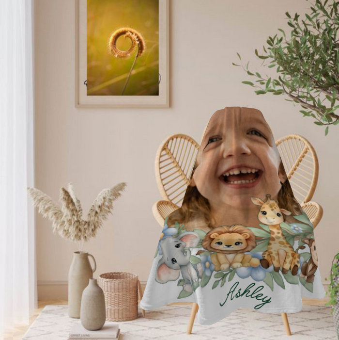 Personalized safari blanket held like a cape, with child photo and animal faces