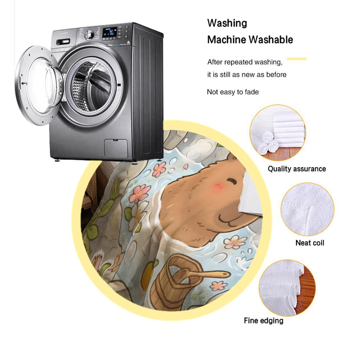Personalized capybara hot spring blanket in washing machine, NAME ROWAN patch visible