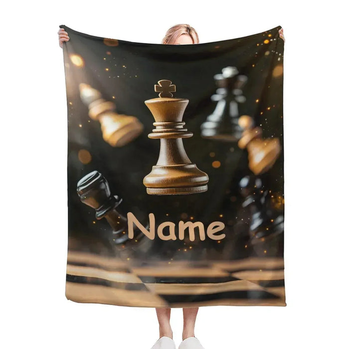 Held chess blanket with dark motif, gold king and knight, and custom name text