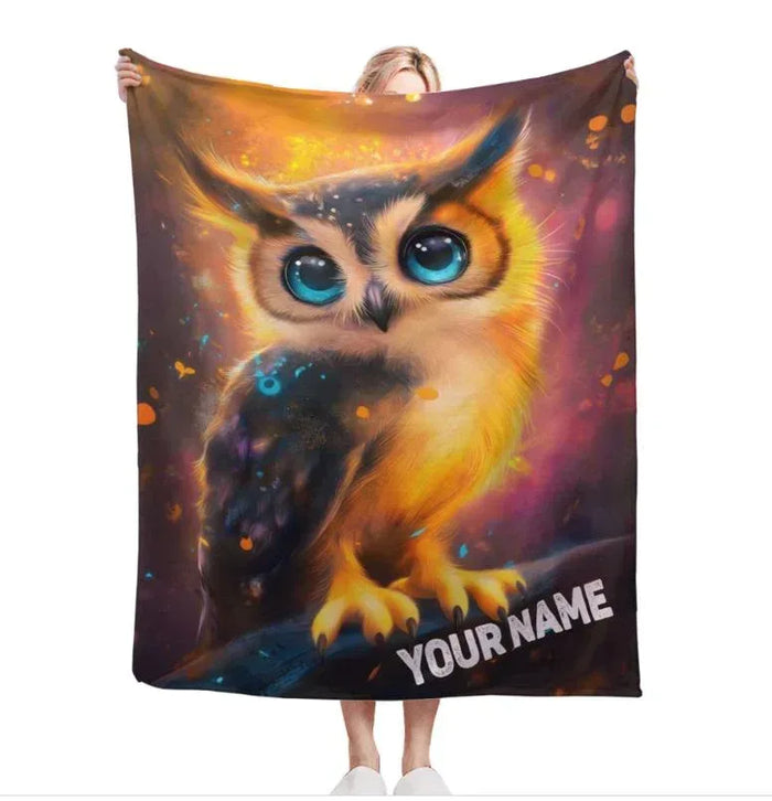 Cosmic owl throw blanket with blue-eyed owl art and YOUR NAME text at bottom