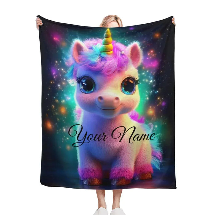 Cosmic unicorn blanket with galaxy print and text Your Name, held up
