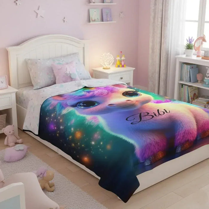 Galaxy unicorn fleece blanket with name Bibi on the bed cover