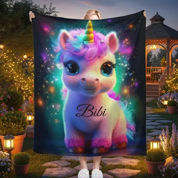 Cosmic unicorn blanket with galaxy print and name Bibi, hung as a throw