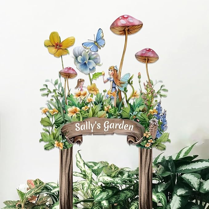 Garden metal sign stake with fairy and butterflies in a flower frame, reads “Sally's Garden”