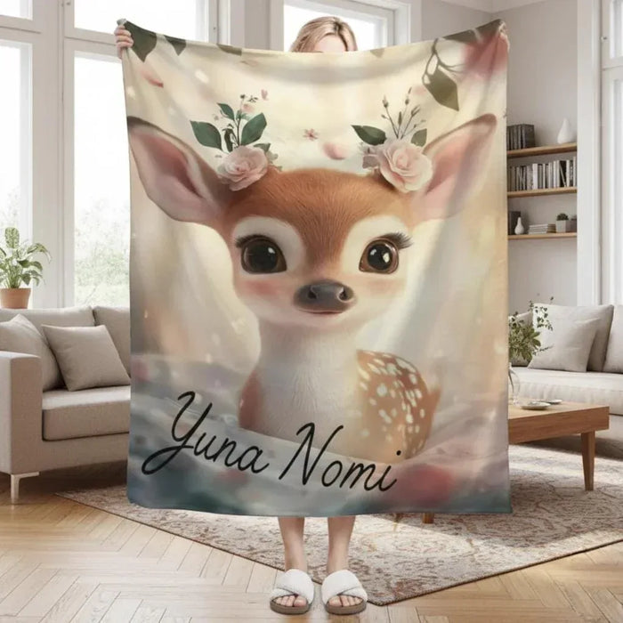 Personalized throw blanket with a cute deer fawn illustration and custom name text