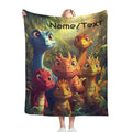 Custom dinosaur name blanket held up with dinosaur faces and Name/Text