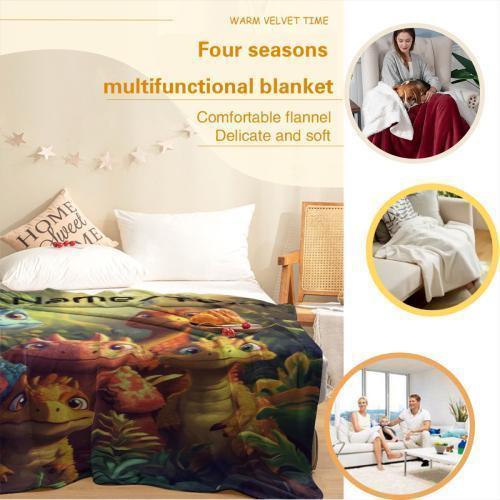 Kids flannel blanket on bed with dinosaur print and matching white pillow