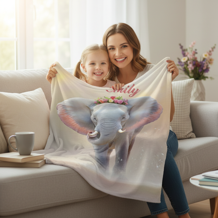 Light cream blanket with large elephant print and pink name text, held up