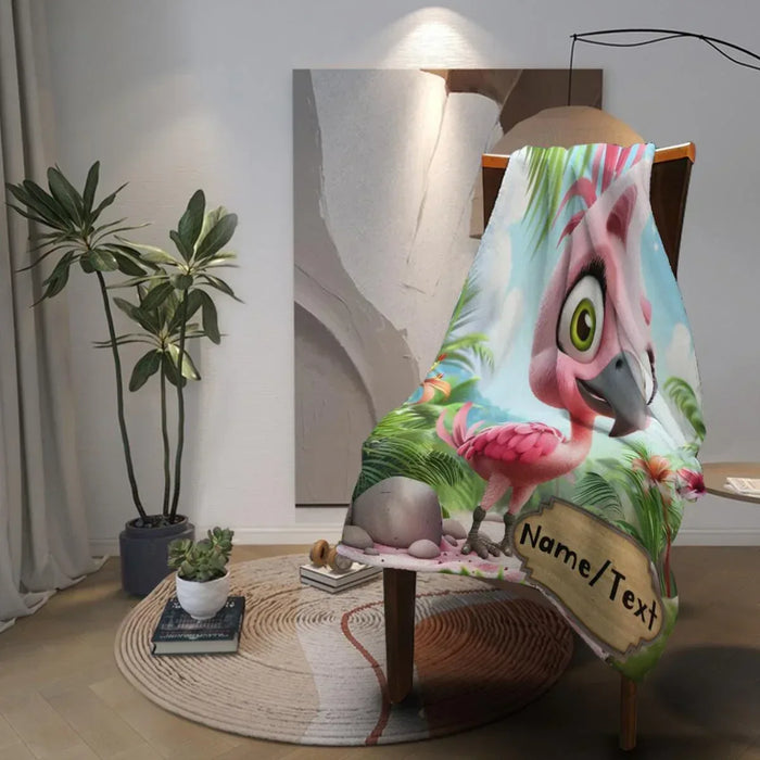 Cartoon flamingo blanket on a chair with tropical leaves and pink bird face
