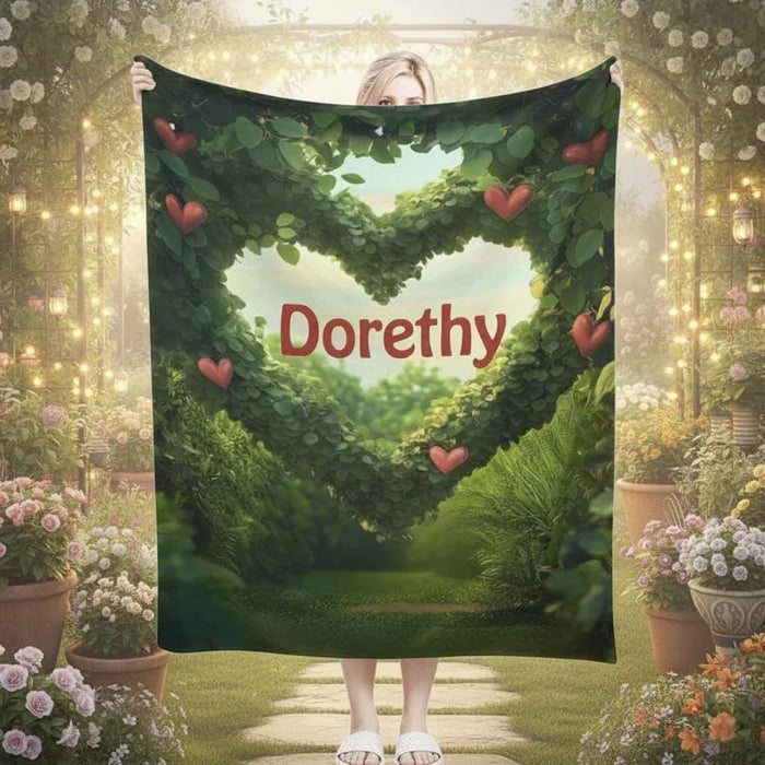 Personalized garden heart throw blanket with green foliage and heart border