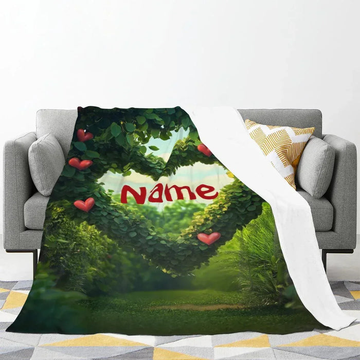 Personalized garden heart throw blanket with green foliage, red hearts, and Name