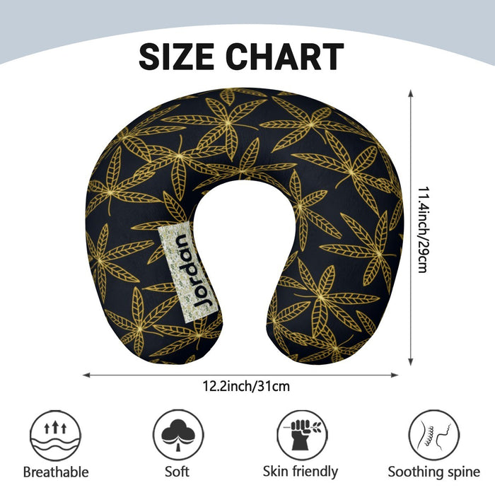 Size-view graphic of gold-leaf travel neck pillow in dark navy with white center opening.
