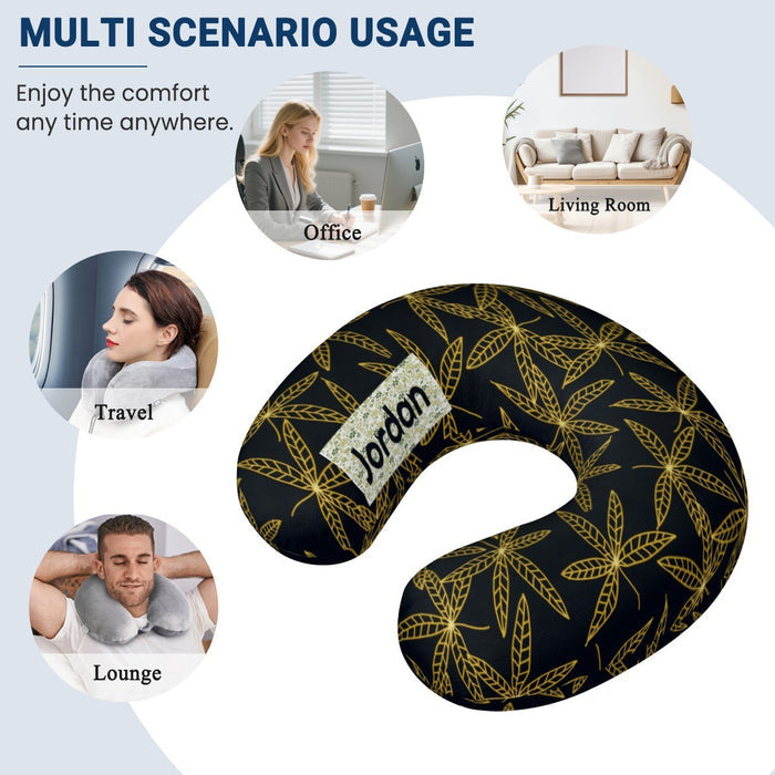Gold-leaf travel neck pillow in dark navy, shown as an all-around neck support.