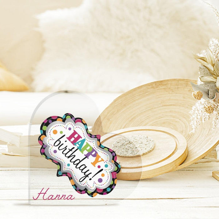 Happy Birthday heart acrylic ornament with 'Hanna' on wooden tabletop