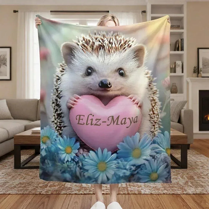 Personalized hedgehog fleece throw blanket with pink heart name and blue flower border
