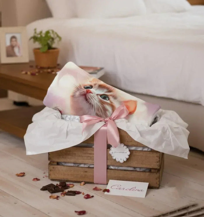 Personalized kitten blanket draped over a cat with pink bow and heart detail