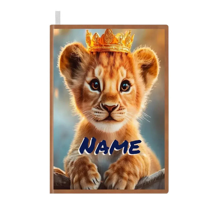A5 notebook cover featuring a lion cub with a golden crown and blue NAME text