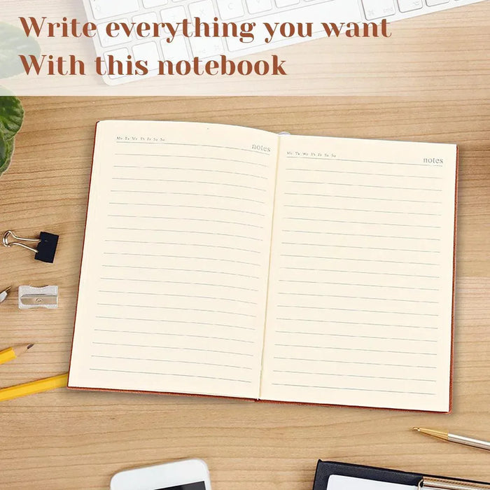 Open notebook with ruled pages and two sections, on a wooden desk with pens